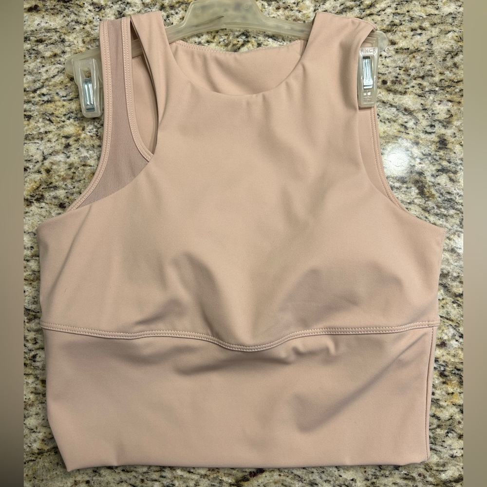 size small (fits like a medium) light pink tank with built in bra